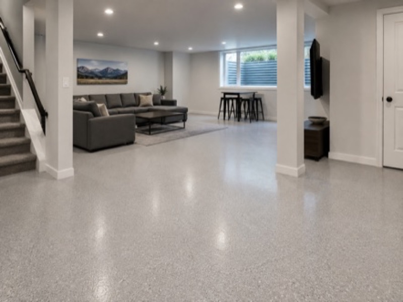 Finished basement floor with light gray epoxy coating in Boulder CO