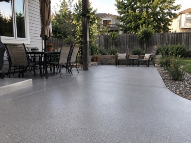 Outdoor patio with polyaspartic concrete coating in a Boulder CO backyard